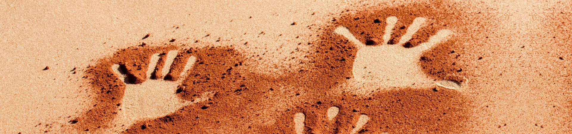 3 hand prints in red earth