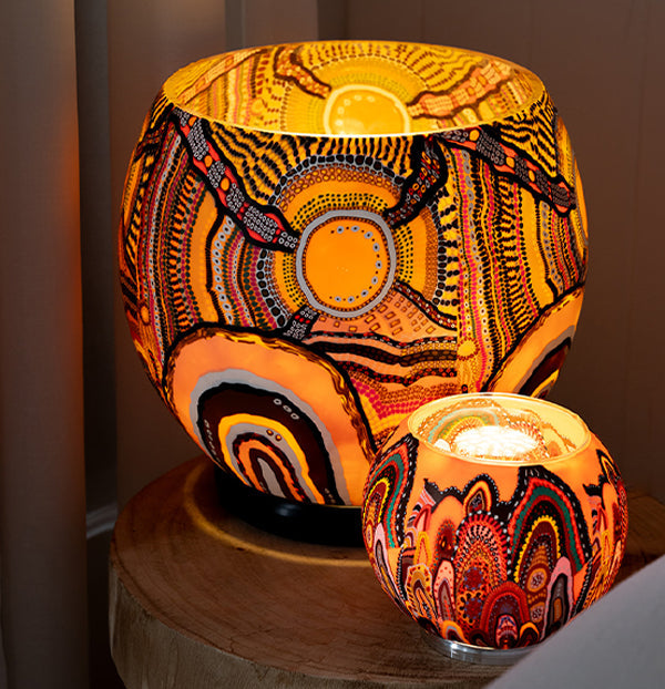 Electric Lamp with aboriginal design illuminated in the dark