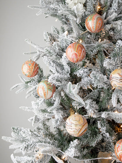 Koh Living Aboriginal Xmas Baubles in Beautiful Journey design hanging on tree