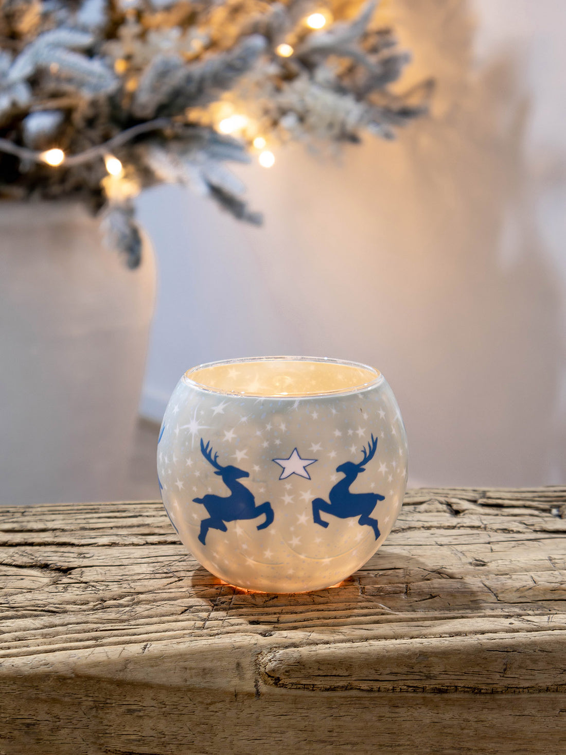 Glowing candle holder with reindeer design