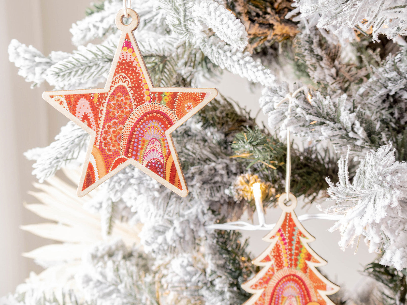 Wooden Australian Christmas decorations hanging on a tree from Koh Living